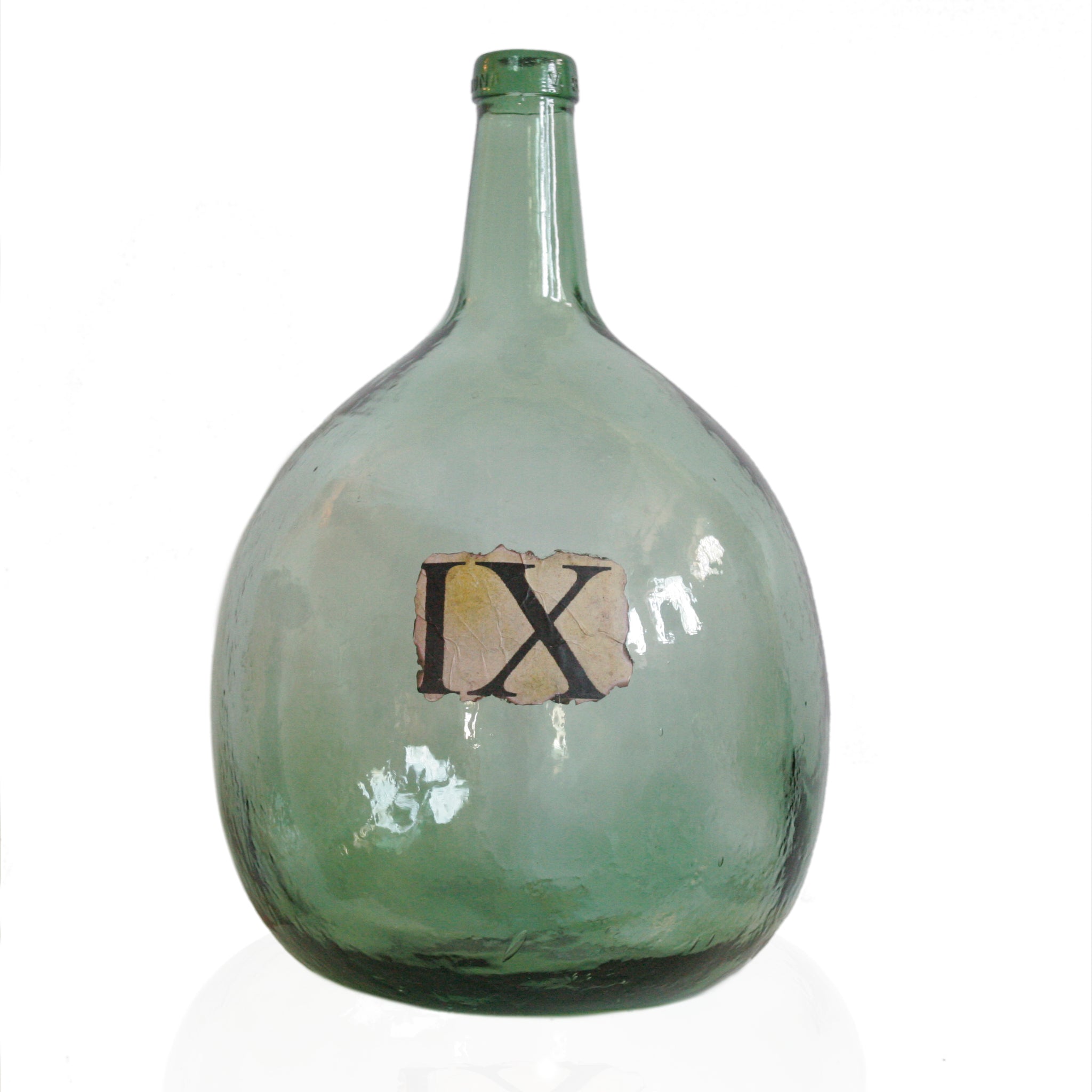 Large antique glass wine jar in green