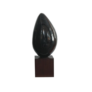 Green waxstone sculpture on walnut stand