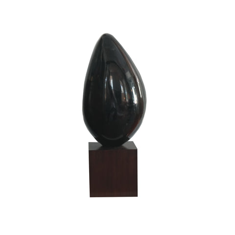 Green waxstone sculpture on walnut stand