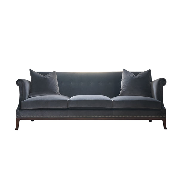 Dark grey velvet three cushion sofa.