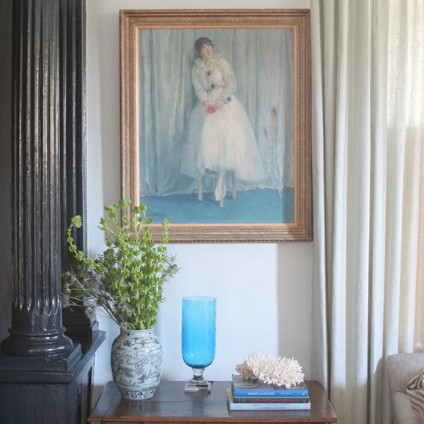 small vignette with an oil on canvas painting of a seated lady