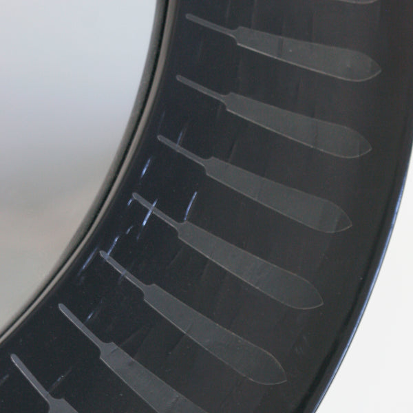 Detail of Patterned inlaid round mirror in black