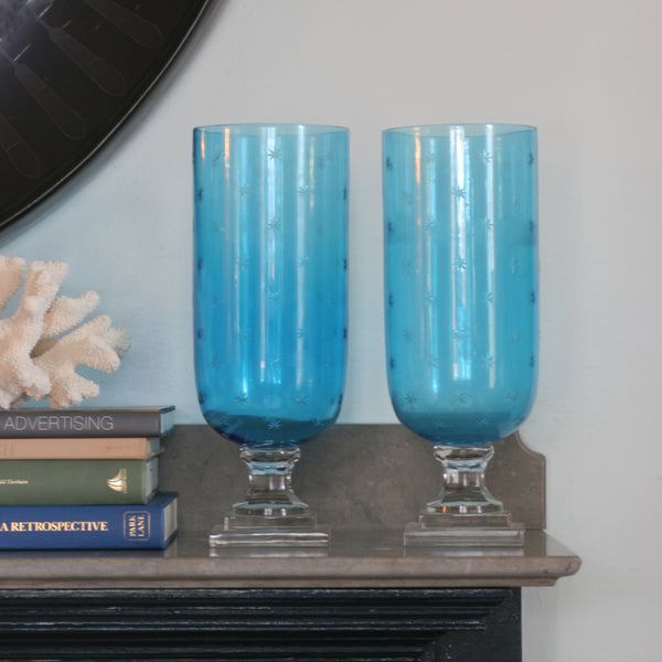  Pair of Blue glass hurricanes with etched star pattern on mantle