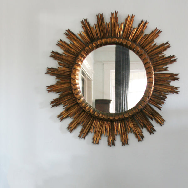 Large Starburst Mirror in Gild on wall